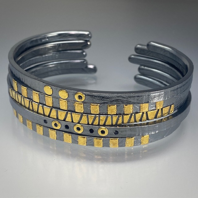 Thin bracelets stacked Thin bracelets stacked